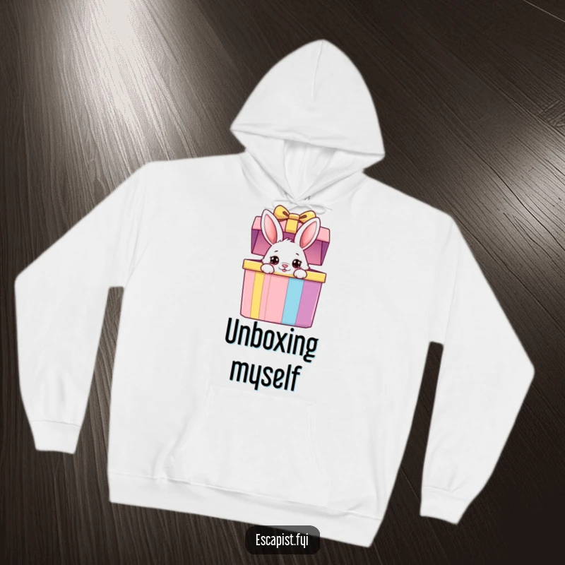 Funny bunny hoodie featuring a fluffy bunny peeking from a giant colorful gift box with wide, curious eyes, offering warmth and cute charm.