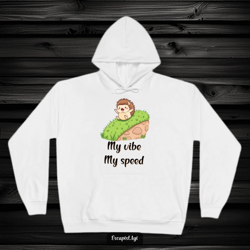 Funny hoodie with a tiny hedgehog in mid-roll down a grassy slope, its arms and legs joyfully flailing.